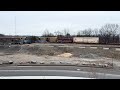 CSX L010 departs Readville with SD40-2 #8873 trailing