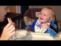 Baby laughing hysterically at ice chewing