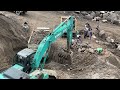 Mining sand with a Kobelco SK200 excavator