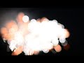 Abstract bokeh background - defocused fireworks display. SEAMLESS LOOP.