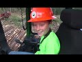 11 year old Phillip loading a log truck with a John Deere 437D