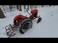 1956 Economy tractor. Out for a ride in the snow!