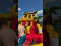 Kids having fun with the bounce house slides.