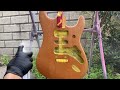 I refinish a guitar with a burnt body and cleaned it up.