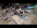 The genius girl changed the tractor bearings and showed the repairman how to fix it.- repair girl