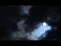 Timelapse of clouds in front of the moon