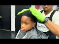 This kid was NOT happy cutting all his hair off