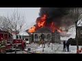 Firefighters fall off ladder at house fire.