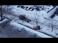 Removing snow banks in a residential neighborhood of Ottawa