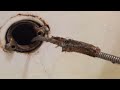 How to Unplug a Bathtub Drain Using a Snake or Drum Auger