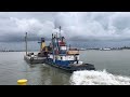 Towboat West Pearl River with CAT-390 excavator. Barge Popeye south bound above Kenner LA.