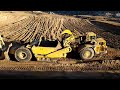 CAT D10N Dozers and 651E scrapers at work - Massive earth moving -