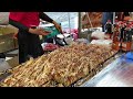 japanese street food - master chef make lot of okonomiyaki at once お好み焼き