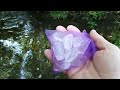 CLEANING QUARTZ CRYSTALS IN THE LOCAL STREAM.