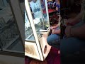 Trying to win cash from the claw machine
