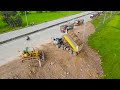 Beginning the Technique Landfill Using Extreme Bulldozer KOMATSU D58E1 Push Soil Next National Road