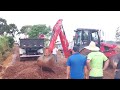 parte 1, retroescavadeira MANITOU trabalhando em vala para adicionar tubos