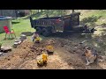 Patio prep work, using the mini Excavator and dump trailer.