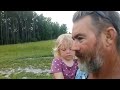 Me and granddaughter checking on the pigs