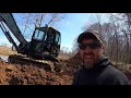 Draining  a pond with the Hyundai HX85A let the water fly