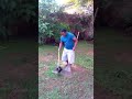 Cleaning up after the dog ... a Zambian animal lover picks dog poo from his front lawn