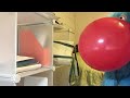 Puppet blowing a balloon