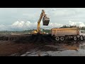 excavator PC300 loading Scania p410 HT