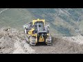 Komatsu D375A-8 pushing big blades