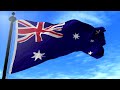 Australia flag waving in blue sky Slow-motion