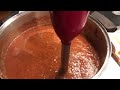 Pureeing tomato sauce with an immersion blender