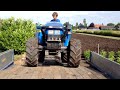 Spitten met een New Holland TCE44