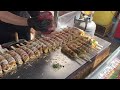 japanese street food - hashimaki はしまき okonomiyaki on a chopstick