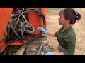 Genius girl repairs and maintains excavators and fixes truck doors