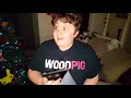 Tristan opening a gift on Christmas Eve 2017