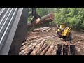 437D John Deere loading some big logs and pushing the R model Mack through the mud!