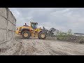 breaking  up excess concrete at a ready  mix plant