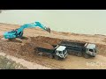 Work activities of excavator kobelco and dump truck