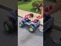 baby boy driving his jeep with his mom