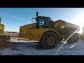 Cat 740/745 Next Gen articulated Trucks - Assisted Hoist System (AHS) operation tutorial.