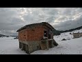 Staying in an abandoned brick house during a snowdrift