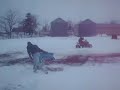 Pulling the sled behind four wheeler