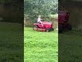 Vicki, aka Gravely Granny, mowing with the newer 24G.