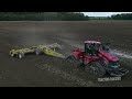 DMI 21 Bottom Plow and Big Bud Tractors