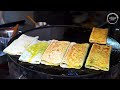Chinese Street Food -Fried noodles with egg fried rice, fried broiler, egg and vegetable pie