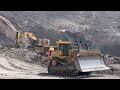 Huge excavator CATERPILLAR 6015 Working in coal mine with cat 773