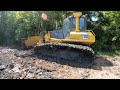 Cleaning out and rebuilding an old pond. While pushing out a lot of muck with the Komatsu dozer.