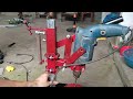 Power transmission mechanism on homemade drilling machine frame.