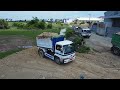 Start the first new project! Komatsu D58E bulldozer pushing soil, Landfill using dump 5ton truck