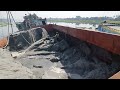 Sand is being unloaded from large ships with powerful dredger machines part-1334