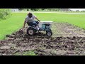 Sears Suburban Tractor cultivating corn in the organic garden